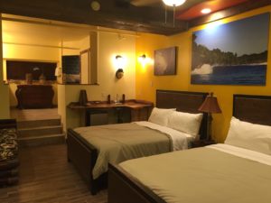 Boutique hotel guest room with warm ambient and task lighting