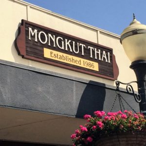 Mongkut Thai restaurant exterior sign lit by street lantern