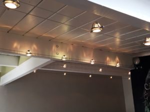Cafe ceiling with track and pendant lighting