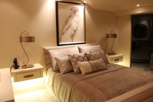 Master bedroom with bedside lamps and integrated cove lighting