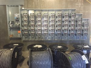 Multi-tenant meter bank with spools of feeder cable ready for install