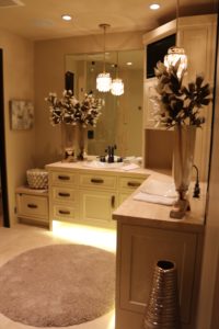 Custom bathroom vanity with pendant lighting and mirror sconces